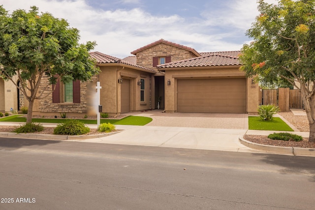 5250 S Wesley Cir, Mesa, AZ 85212 - mediterranean / spanish-style house with an attached garage, stucco siding, driveway, and a tile roof