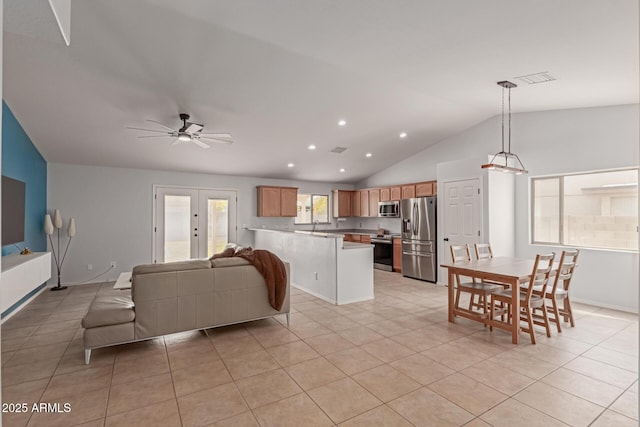 tiled living room featuring vaulted ceiling and ceiling fan