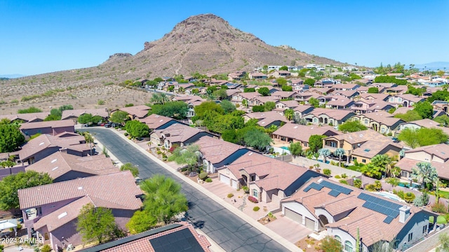 birds eye view of property featuring a mountain view