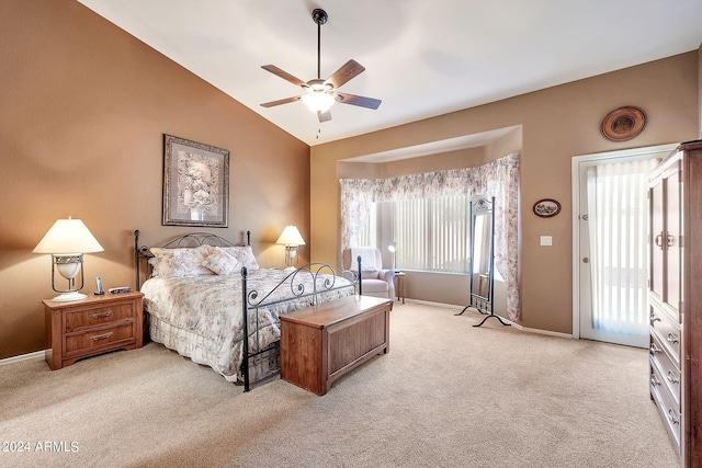 carpeted bedroom featuring ceiling fan, access to exterior, and vaulted ceiling