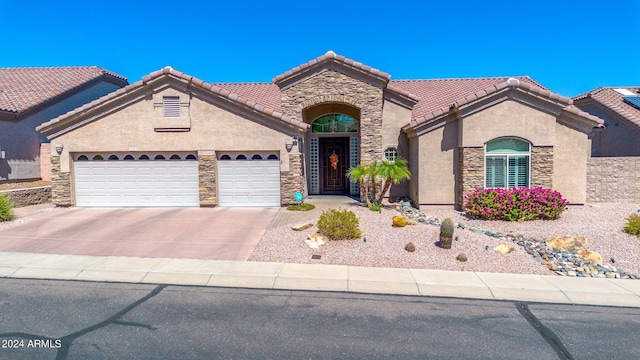 view of front of property with a garage