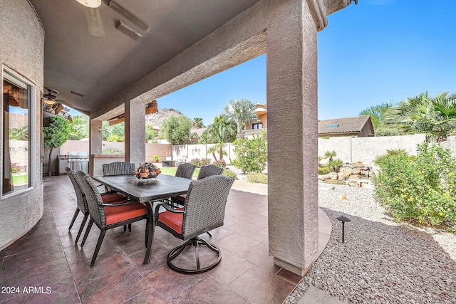 view of patio featuring ceiling fan