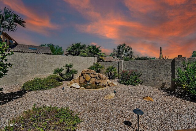 view of patio terrace at dusk