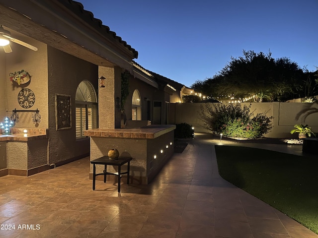 view of patio terrace at dusk