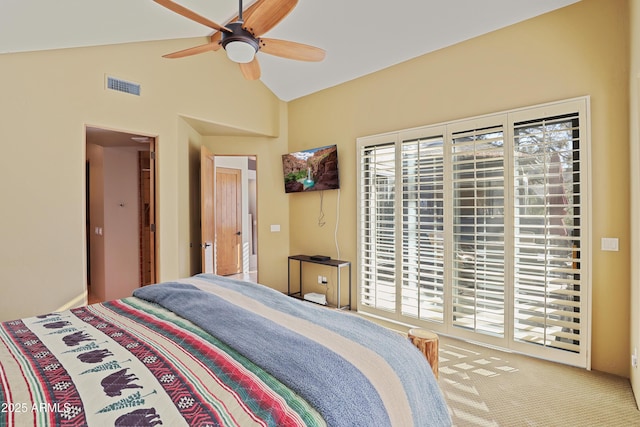 bedroom with ceiling fan, carpet floors, and vaulted ceiling