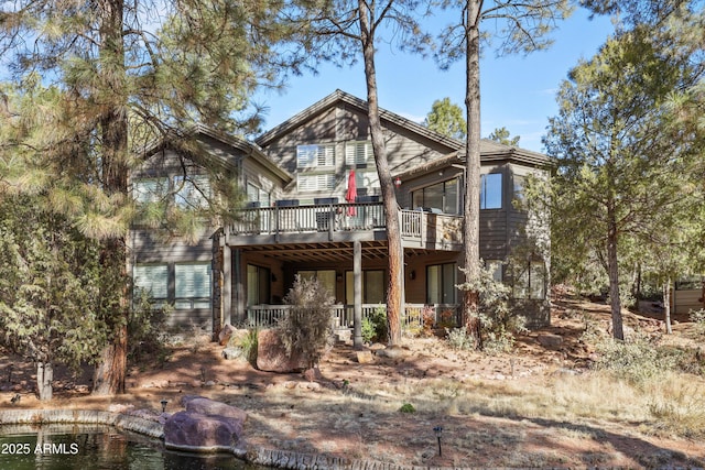 back of property featuring a deck