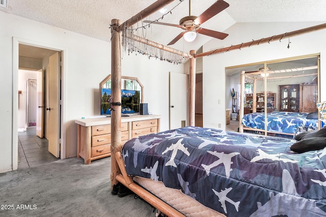 bedroom featuring light tile patterned floors, lofted ceiling, ceiling fan, a textured ceiling, and light carpet