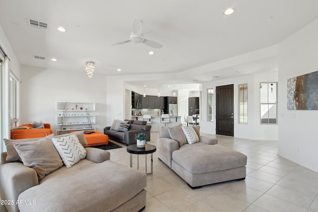 living room featuring a ceiling fan, recessed lighting, visible vents, and light tile patterned flooring