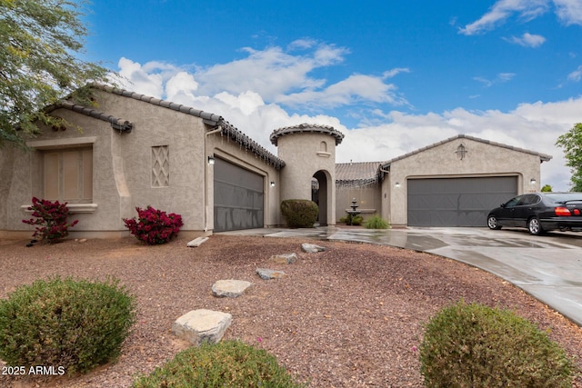 mediterranean / spanish home featuring a garage