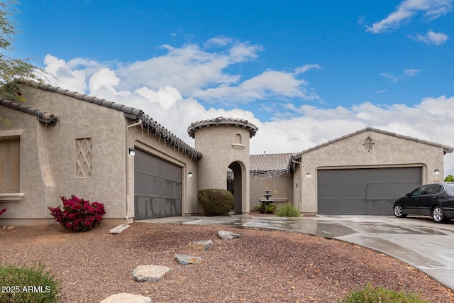 mediterranean / spanish-style home featuring a garage