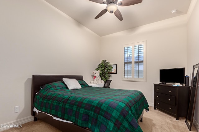 bedroom with ceiling fan, lofted ceiling, and light colored carpet