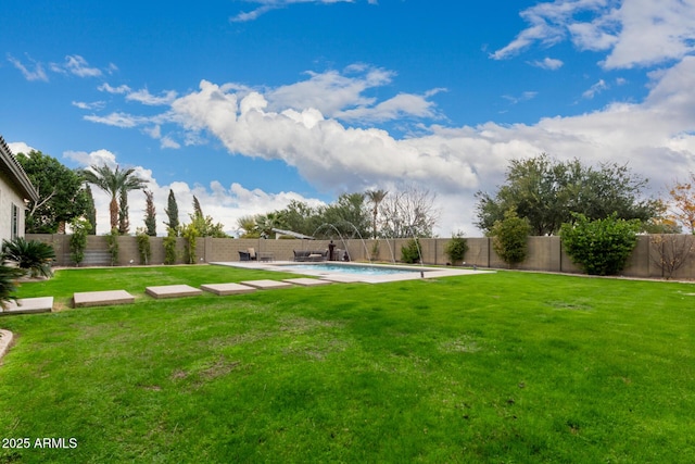 view of yard with pool water feature and a fenced in pool