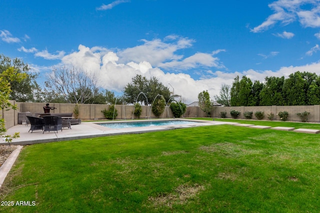 view of swimming pool featuring pool water feature, a patio area, and a yard