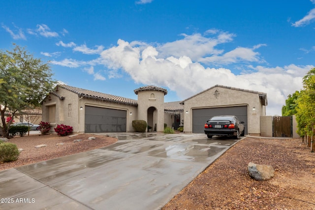 mediterranean / spanish house featuring a garage