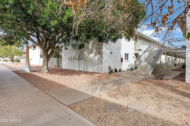 view of property exterior with stairs