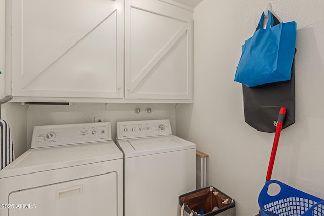 laundry room with cabinet space and washer and dryer