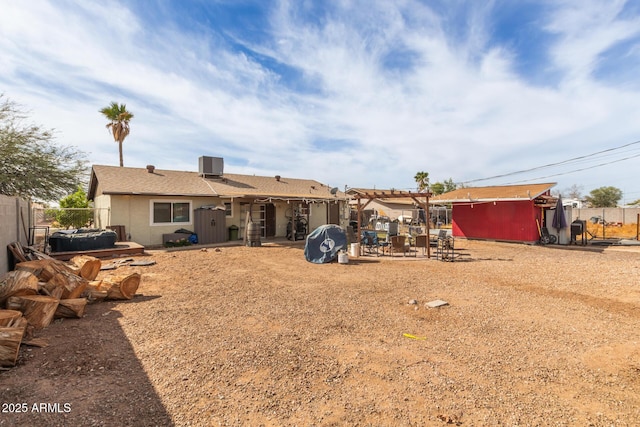 rear view of house featuring a patio area, fence, central AC, and a pergola