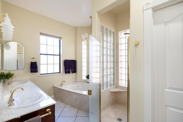 bathroom featuring vanity, independent shower and bath, and tile patterned flooring