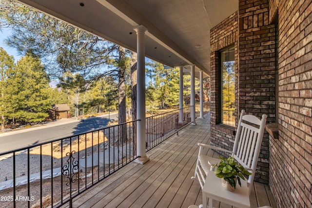 wooden terrace featuring covered porch