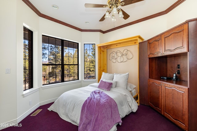 bedroom with crown molding, dark carpet, and ceiling fan