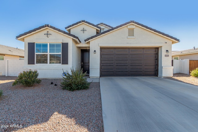 single story home featuring a garage