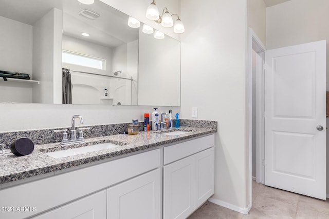 bathroom featuring a shower with shower curtain, vanity, and tile patterned floors