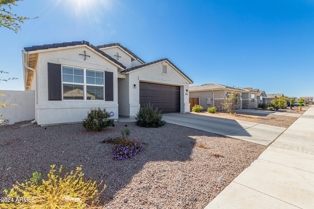 single story home featuring a garage