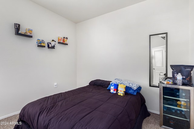 carpeted bedroom featuring wine cooler