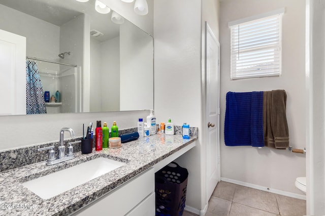 bathroom with tile patterned floors, vanity, toilet, and a shower with shower curtain