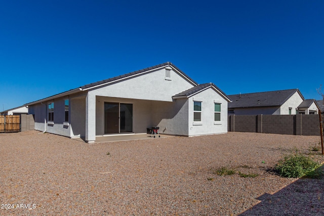 rear view of house with a patio