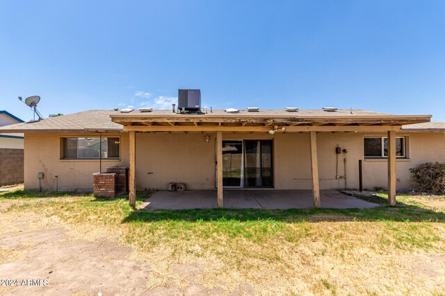 back of property featuring a patio area and cooling unit