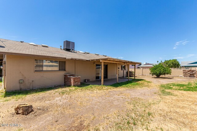 back of house with central AC unit and a patio area