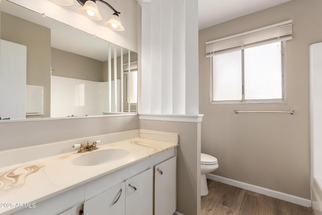 5625 N 47th Ave, Glendale, AZ 85301 - full bath featuring vanity, wood finished floors, toilet, and baseboards