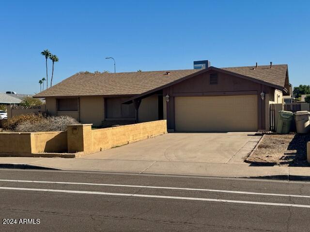 single story home with a garage