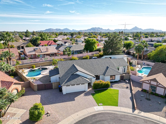 birds eye view of property featuring a mountain view