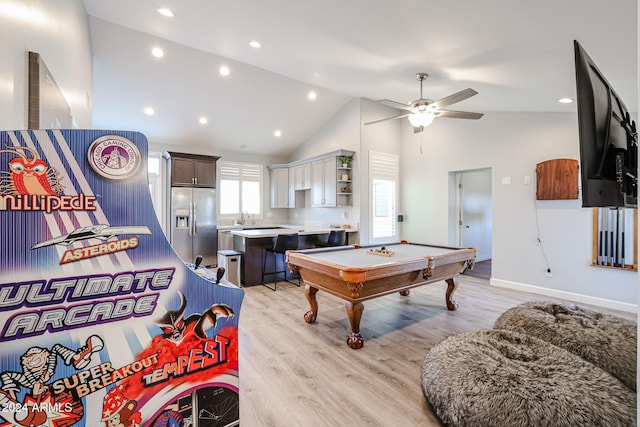 playroom with ceiling fan, sink, light hardwood / wood-style flooring, high vaulted ceiling, and pool table