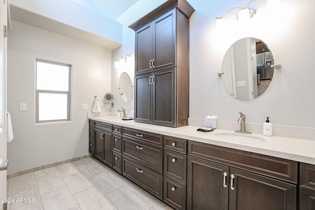 bathroom with tile patterned flooring and vanity