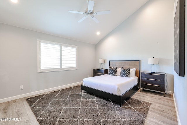 bedroom featuring ceiling fan, high vaulted ceiling, and wood-type flooring