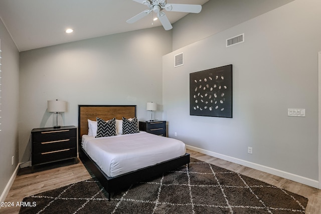 bedroom featuring hardwood / wood-style flooring, ceiling fan, and lofted ceiling