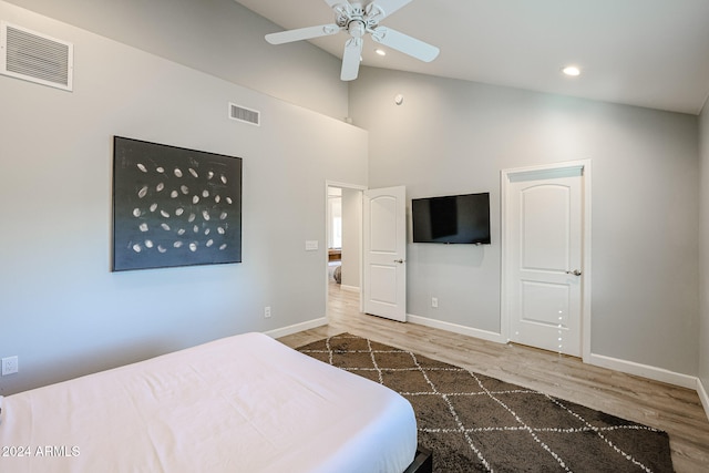 bedroom featuring ceiling fan, dark wood-type flooring, and high vaulted ceiling