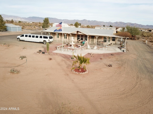 view of front of home with a mountain view