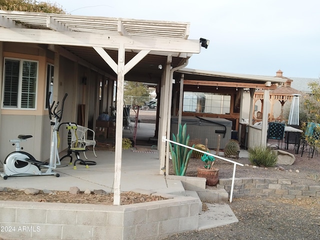 view of patio featuring a hot tub