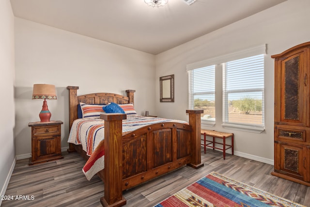 bedroom featuring dark wood-type flooring