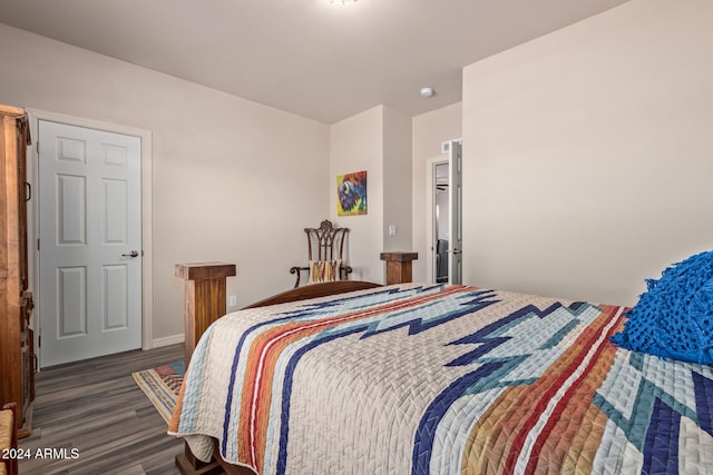 bedroom featuring dark hardwood / wood-style flooring