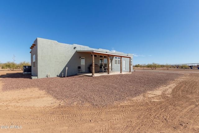 rear view of house with a patio