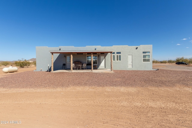 back of property featuring a patio