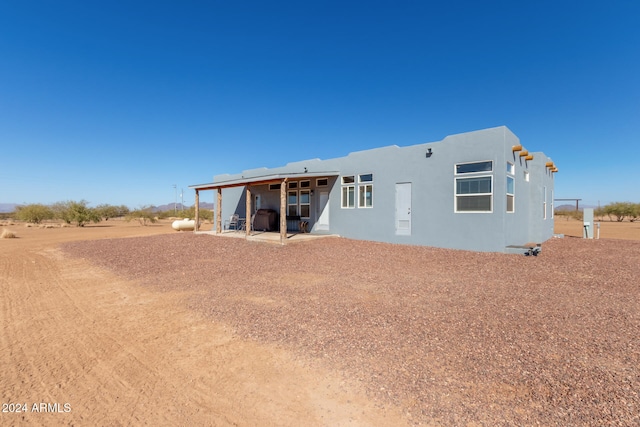 rear view of house with a patio