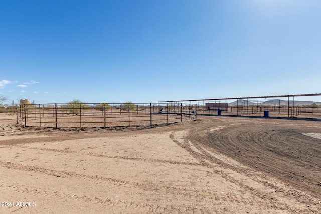 view of yard with a rural view