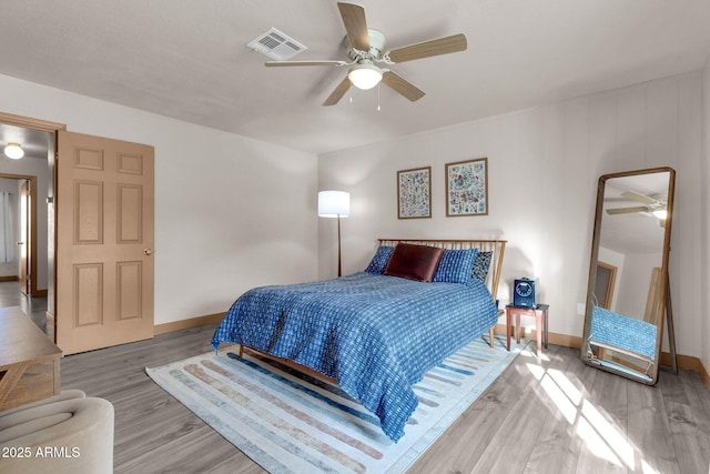 bedroom featuring light wood-type flooring and ceiling fan