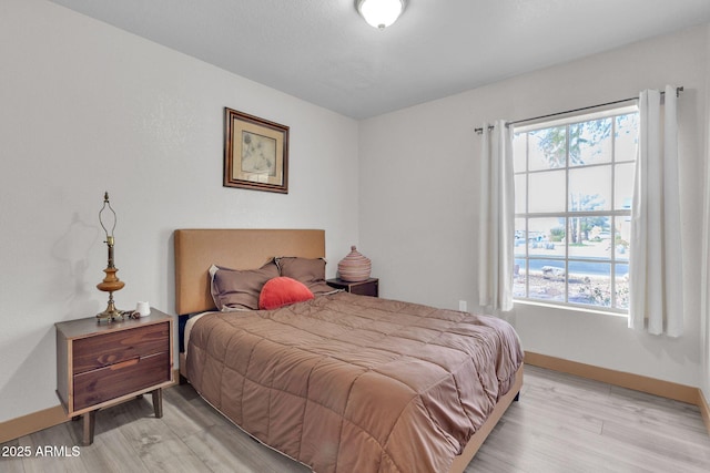 bedroom featuring light hardwood / wood-style floors